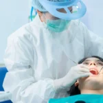 female-patient-at-dental-procedure-using-dental-dr-2022-12-16-18-15-05-utc-1
